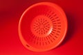 Orange kitchen strainer