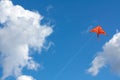 Orange kite in the sky Royalty Free Stock Photo