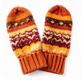 Orange Knitted Mittens with Brown and Red Pattern Royalty Free Stock Photo