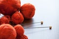 Orange knitwork with thread balls in a basket Royalty Free Stock Photo
