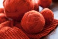 Orange knitwork with thread balls in a basket Royalty Free Stock Photo