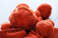 Orange knitwork with thread balls in a basket Royalty Free Stock Photo