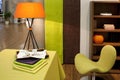Orange lamp with green chair