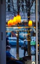 Orange lanterns in the form of a straw chandelier in a dim room