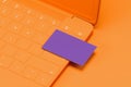 Orange laptop with violet blank business card on orange background. 3d rendering. Cozy working place. Minimalism