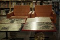 Orange leather chairs in a library with wooden bookcases. Knowledge and education. Blurred
