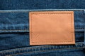 Orange leather label on blue jeans with copy space for your text Royalty Free Stock Photo