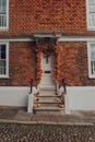 Orange leaves and pumpkins Halloween decorations by the entrance to house in Rye, UK