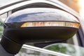 Orange LED turn signal in the mirror of a modern car, close-up Royalty Free Stock Photo