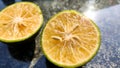 Orange lemon background.Double slice of lemon selective focus on texture background with copy space Royalty Free Stock Photo