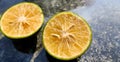 Orange lemon background.Double slice of lemon selective focus on texture background with copy space Royalty Free Stock Photo