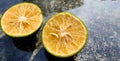 Orange lemon background.Double slice of lemon selective focus on texture background with copy space Royalty Free Stock Photo