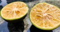 Orange lemon background.Double slice of lemon selective focus on texture background with copy space Royalty Free Stock Photo