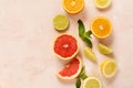 Orange, lemon, grapefruit, mandarin and lime on trendy pink stone or concrete table background. Citrus fruits. Top view, flat lay Royalty Free Stock Photo