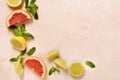 Orange, lemon, grapefruit, mandarin and lime on trendy pink stone or concrete table background. Citrus fruits. Royalty Free Stock Photo