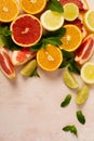 Orange, lemon, grapefruit, mandarin and lime on trendy pink stone or concrete table background. Citrus fruits. Top view, flat lay Royalty Free Stock Photo