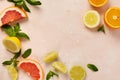Orange, lemon, grapefruit, mandarin and lime on trendy pink stone or concrete table background. Citrus fruits. Top view, flat lay Royalty Free Stock Photo