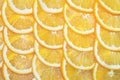 Orange lemon slices, yellow background. an orange cut into slices is lying on the table Royalty Free Stock Photo