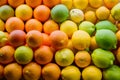 Orange lemons in market, fresh citrus fruit display, produce photo