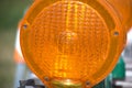 The orange lens of a construction barricade light contains some interesting patterns. Royalty Free Stock Photo