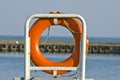 Orange life buoy ring life belt in port Royalty Free Stock Photo