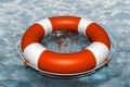 Orange life buoy in the water Royalty Free Stock Photo