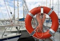 Lifebelt Lifebuoy in the marina or yacht belt
