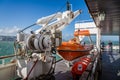 Orange Lifeboat on board Channel Ferry at sea with hydraulic winch