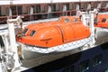 Orange lifeboat of the cruise ship in downtown Vancouver, British Columbia, Canada