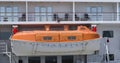 Orange lifeboat on a cruise ship Royalty Free Stock Photo