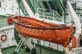 Orange lifeboats on the ship's davits