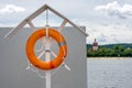 Orange lifebuoy at the beach, lifeguard float. lifeguard equipment, life saver or life ring. Concept of vacation and safety when Royalty Free Stock Photo