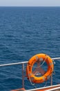 Orange lifebuoy on the deck of a passenger ferry Royalty Free Stock Photo