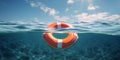 Orange Lifebuoy Floating on Ocean Water with Waves. Life Saving Ring in Blue Sea Under Sunlight. Safety Concept Royalty Free Stock Photo