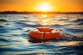 Orange lifebuoy floating in open sea, rescue and safety concept, nautical emergency equipment Royalty Free Stock Photo