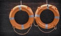 Orange lifebuoy hanging on the wall Royalty Free Stock Photo