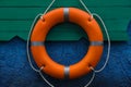 Orange lifebuoy hanging on wall. Rescue equipment Royalty Free Stock Photo