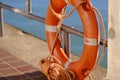 Orange lifebuoy, insure your life Royalty Free Stock Photo