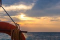 orange lifebuoy on a pebbly sea beach Royalty Free Stock Photo