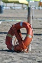 Lifebuoy and rope on the beach Royalty Free Stock Photo