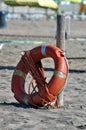 Lifebuoy and rope on the beach