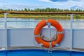 Orange lifebuoy on the ship