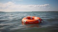 Orange lifebuoy on the water in the blue sea. Safety on the water, rescue of a drowning person