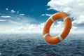 Orange Lifebuoy on the water. The concept of help, rescue, drowning, storm. Copy space Royalty Free Stock Photo