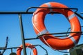 Orange lifeline on the deck of the boat