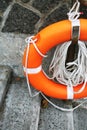 Orange lifesaver located next to steps