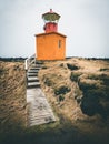 Orange Lighthouse Svortuloft Skalasnagi tower in Snaefellsnes Peninsula, west Iceland on an overcast day.