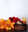 Orange lilies, red tulip and chocolate cake for Valentine's Day Royalty Free Stock Photo