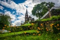 Orange lillies and St. Peters Roman Catholic Church, in Harpers