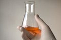 Orange liquid in Erlenmeyer flask